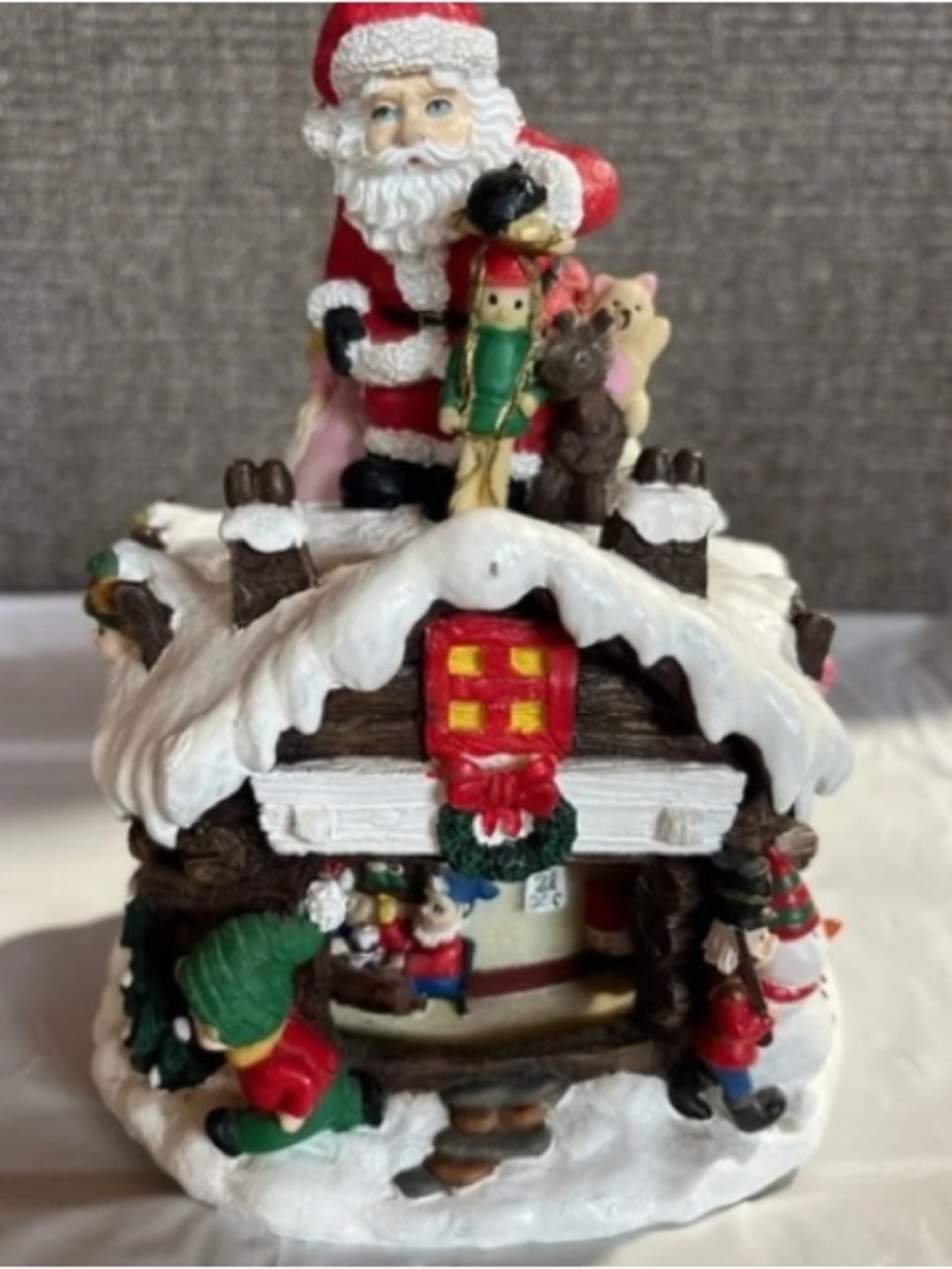 Festive Red Santa Cottage Ornament with Toy Elves